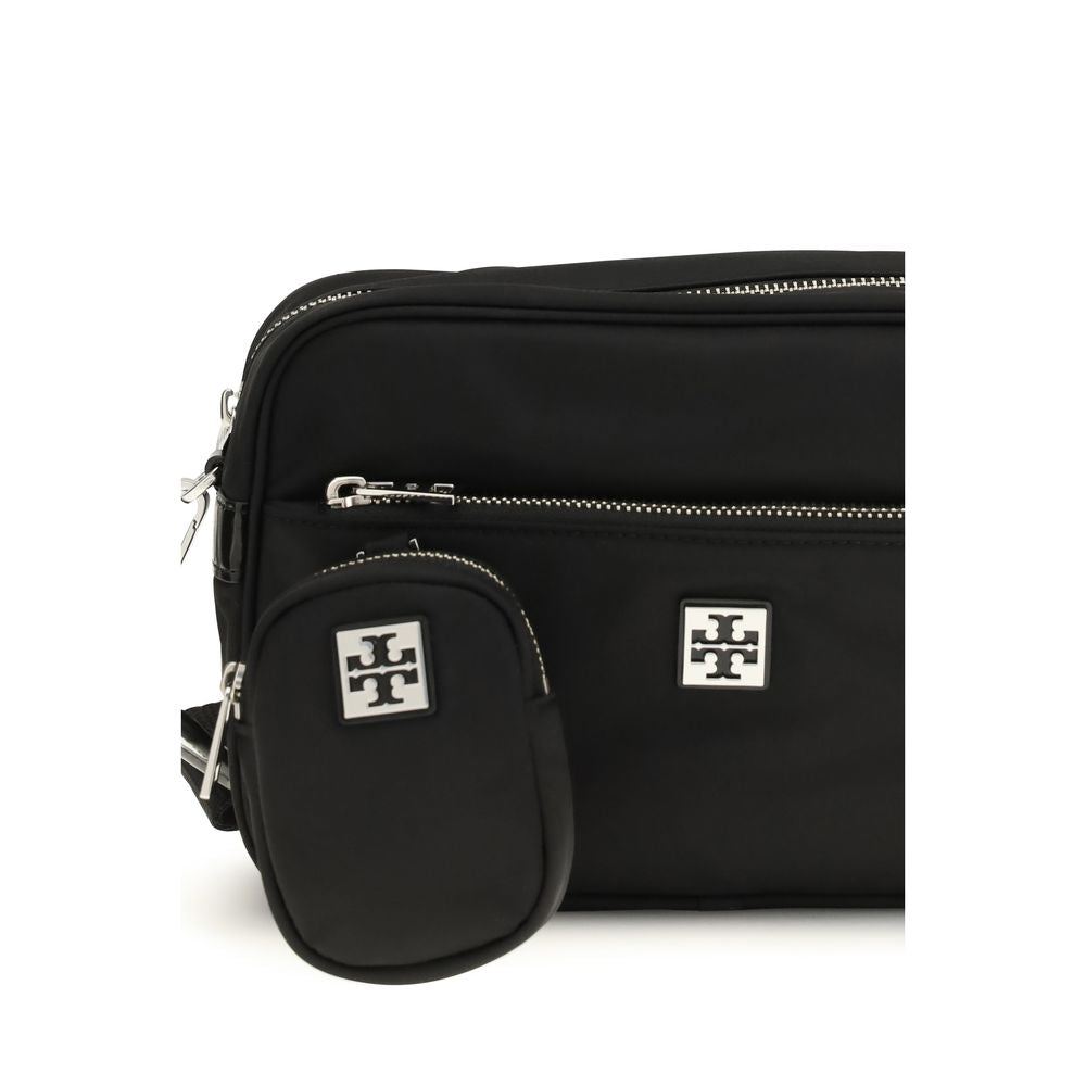 Shoulder Pouch Bag by Tory Burch for women in nylon leather black showcases a enviable silhouette, artfully detailed with a secure zipper, organized , and versatile shoulder-strap & adjustable-strap for a enviable look.