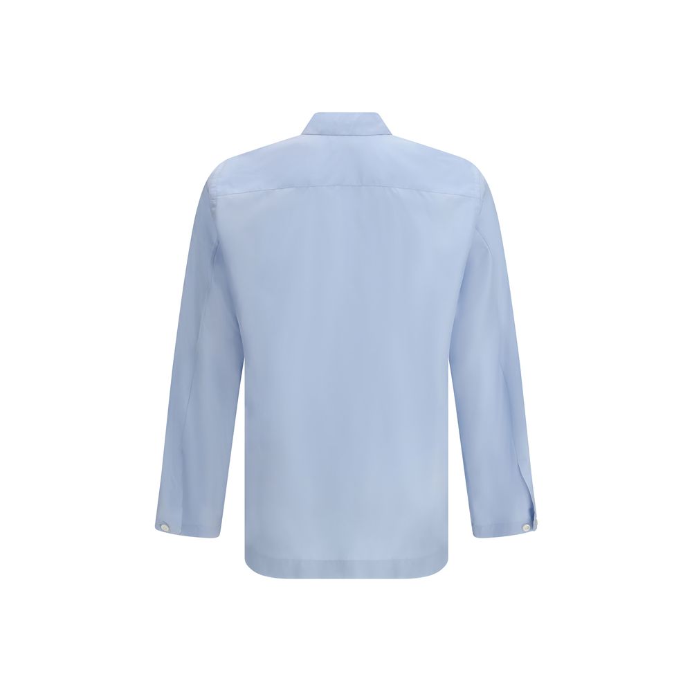 Shirt by Umit Benan for men in silk blue & havana showcases a sharp silhouette, elegantly detailed with a sharp and sharp .