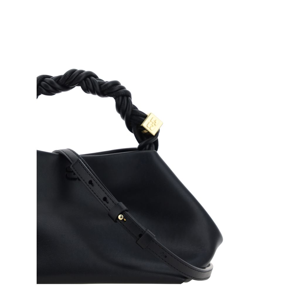 Handbag by Ganni for women in polyester polyurethane leather black features a refined silhouette, showcasing a secure magnetic, organized , and versatile shoulder-strap, handle & adjustable-strap for a refined finish.