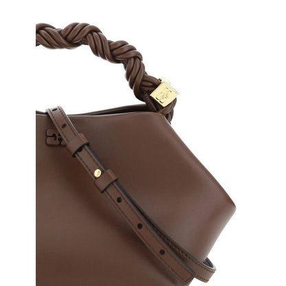 This Mini Handbag by Ganni for women in nylon polyester polyurethane & calf leather and brown presents a sculptural silhouette featuring a secure magnetic, ample built-in-compartments, and versatile shoulder-strap, handle & adjustable-strap for a sculptural finish.