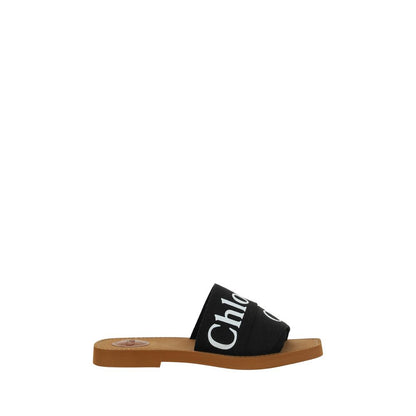 Flat Sandals by Chloé for women in polyester cotton & linen black & signature presents a sculptural silhouette, showcasing the Woody Women's Polyester Cotton & Linen Flat Sandals design with a sculptural flat and square toe style for a premium look.