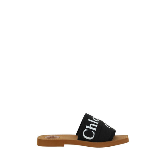 Flat Sandals by Chloé for women in polyester cotton & linen black & signature presents a sculptural silhouette, showcasing the Woody Women's Polyester Cotton & Linen Flat Sandals design with a sculptural flat and square toe style for a premium look.
