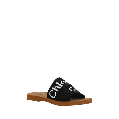 Flat Sandals by Chloé for women in polyester cotton & linen black & signature features an statuesque Woody Women's Polyester Cotton & Linen Flat Sandals silhouette with a refined flat and elegant square toe style.