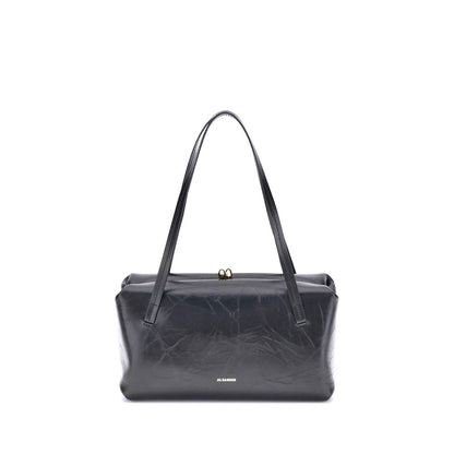 Small Shoulder Clutch Bag by Jil Sander for women in bos taurus calf leather black presents a versatile silhouette, showcasing a secure snap and versatile cardholder with versatile shoulder-strap & handle for a sophisticated look.