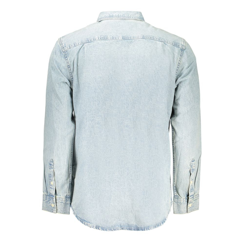 Shirt by Calvin Klein for men in denim blue features an architectural silhouette with a refined and elegant for a architectural look.
