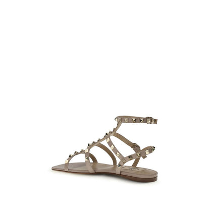 Flat Sandals by Valentino Garavani for women in bos taurus calf leather pink features an effortlessly chic silhouette from the Rockstud Women's Bos Taurus Calf Leather Flat Sandals collection, showcasing a effortlessly chic flat and elegant .