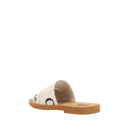 Flat Sandals by Chloé for women in polyester cotton & linen white & signature presents a sculptural silhouette, showcasing the Woody Women's Polyester Cotton & Linen Flat Sandals design with a sculptural flat and square toe style for a premium look.
