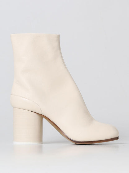 Ankle Boots by Maison Margiela for women in leather white features an avant-garde Women's Leather Ankle Boots silhouette, defined by a sophisticated and a avant-garde .