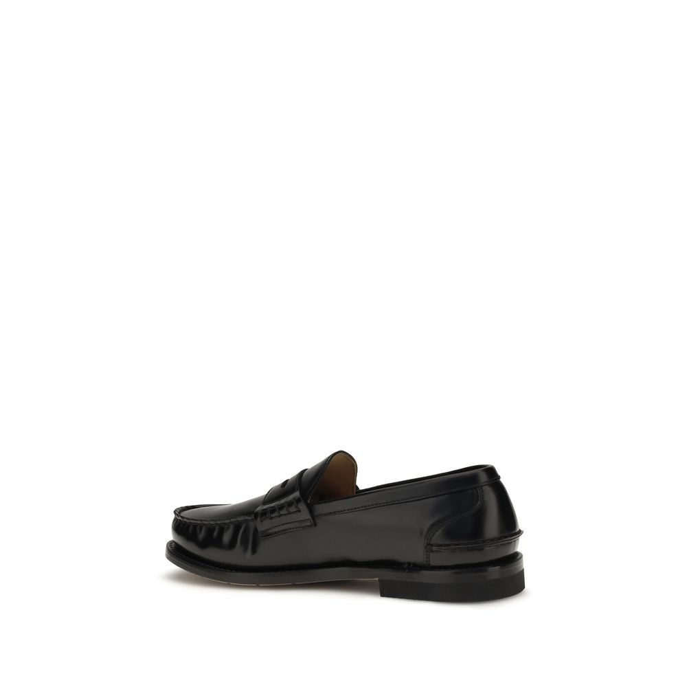 Loafer Slip-On Shoes by Premiata for men in bos taurus calfskin leather black showcases a timeless silhouette from the Men's Bos Taurus Calfskin Leather Loafer Slip-On Shoes collection, featuring a timeless and for a timeless finish.