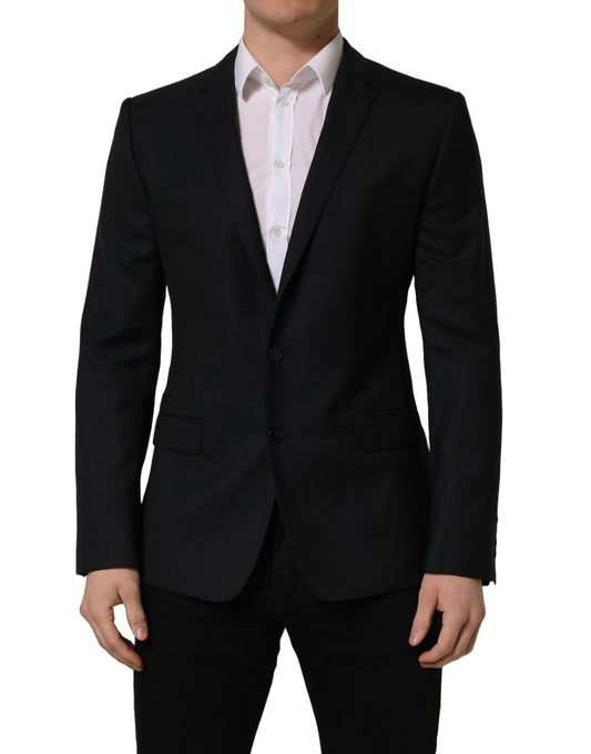 This Blazer by Dolce & Gabbana for men in viscose & virgin wool black presents a tailored silhouette, meticulously tailored with a tailored wrap single-breasted neckline and distinctive for a tailored finish.