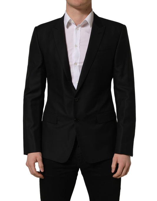 This Blazer by Dolce & Gabbana for men in virgin wool silk viscose & cupro black presents a tailored silhouette, meticulously tailored with a tailored wrap single-breasted neckline and distinctive for a tailored finish.