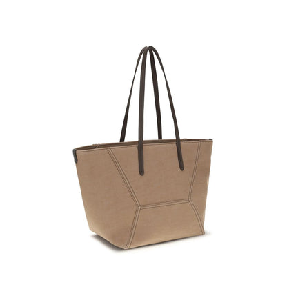 This Shoulder Trapeze Handbag by Brunello Cucinelli for women in poly cotton canvas & leather and beige presents a sculptural silhouette featuring a secure , ample , and versatile shoulder-strap & handle for a sculptural finish.