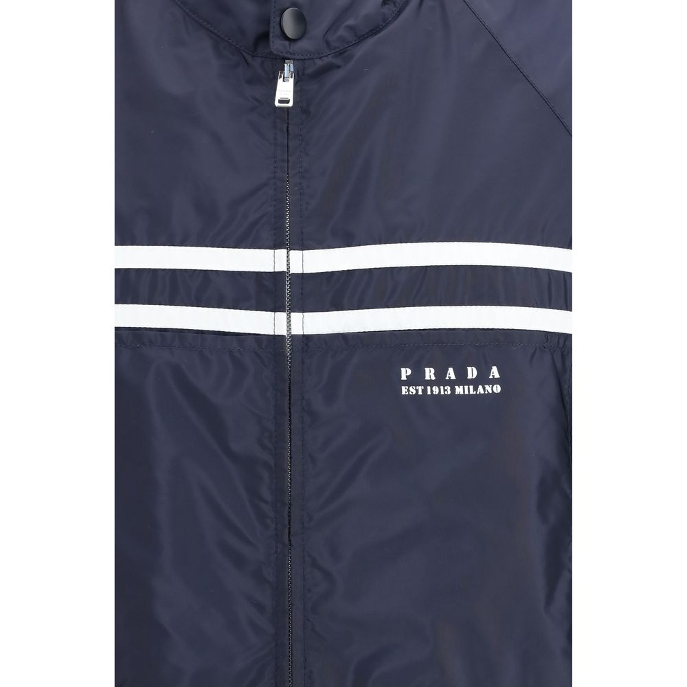 Hooded Windbreaker Jacket by Prada for men in nylon blue features an stylish silhouette, showcasing a sophisticated and performance-driven pockets, hooded & windproof for a premium, stylish look.