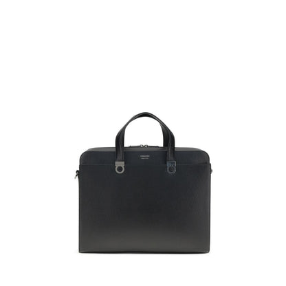 Large Briefcase by Ferragamo for men in bos taurus calf leather black & jacquard features a utilitarian chic Gancini Ribbon Bos Taurus Calf Leather Large Briefcase design with a secure magnetic, utilitarian chic external-pockets, and versatile shoulder-strap, adjustable-strap & handle for a sophisticated look.