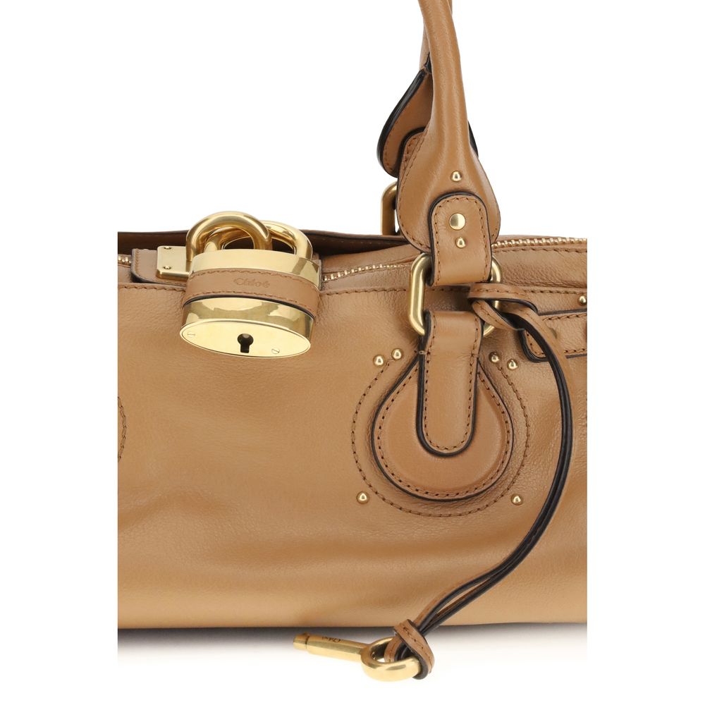 Shoulder Bag by Chloé for women in bos taurus suede leather & alpaca wool brown & signature showcases a enviable silhouette, artfully detailed with a secure zipper, organized , and versatile shoulder-strap for a enviable look.