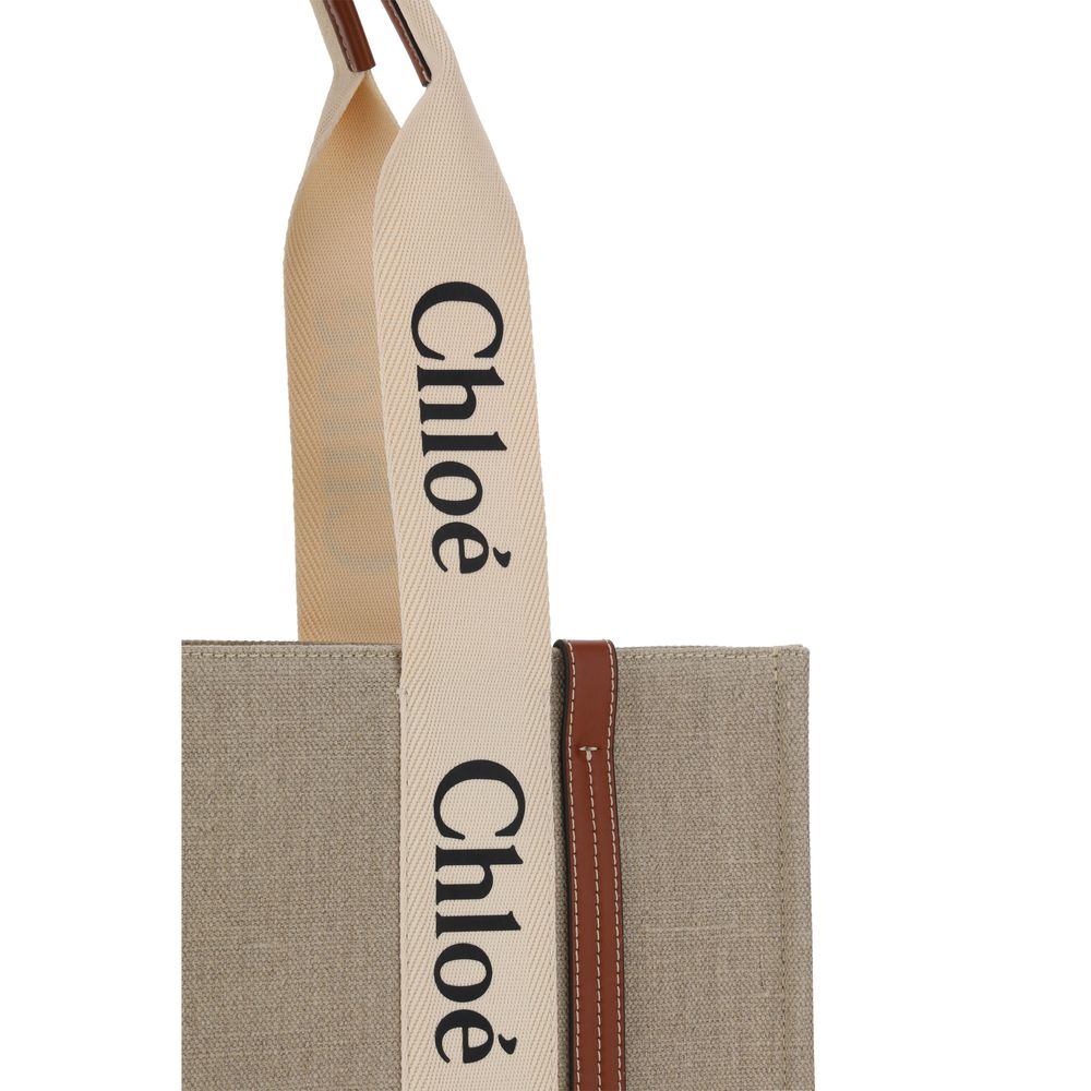 This Shoulder Handbag by Chloé for women in linen & leather and beige, signature, monogram & print presents a sculptural silhouette featuring a secure , ample , and versatile shoulder-strap, handle & adjustable-strap for a sculptural finish.