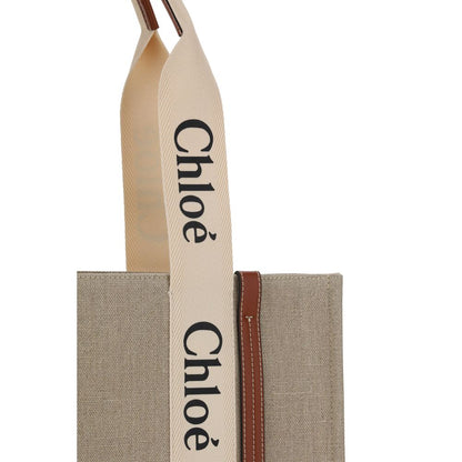 This Shoulder Handbag by Chloé for women in linen & leather and beige, signature, monogram & print presents a sculptural silhouette featuring a secure , ample , and versatile shoulder-strap, handle & adjustable-strap for a sculptural finish.