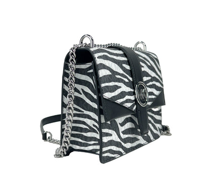 Small Crossbody Travel Tote Handbag by Michael Kors for women in synthetic polyurethane leather animal, black, silver, white & print features an multi-faceted design with a secure magnetic, ample built-in-compartments, and versatile crossbody-strap for a multi-faceted finish.