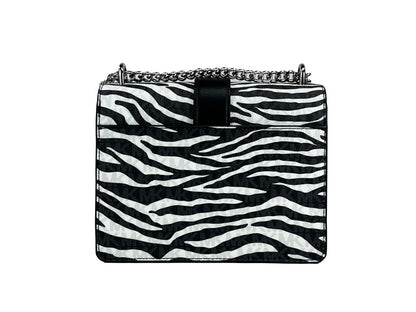 Small Crossbody Travel Tote Handbag by Michael Kors for women in synthetic polyurethane leather animal, black, silver, white & print features an versatile silhouette, showcasing a secure magnetic and versatile built-in-compartments with versatile crossbody-strap for a versatile finish.