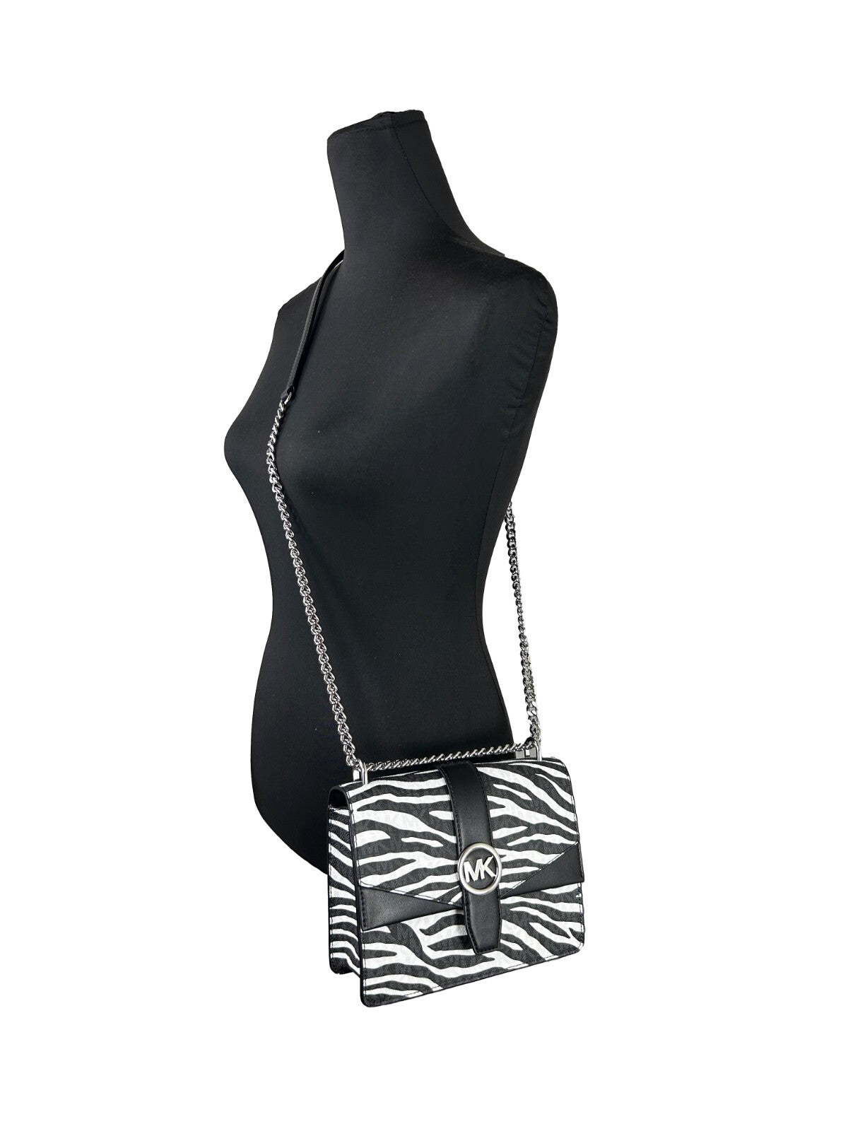 Small Crossbody Travel Tote Handbag by Michael Kors for women in synthetic polyurethane leather animal, black, silver, white & print features a transformative sophistication silhouette, showcasing a secure magnetic, ample built-in-compartments, and versatile crossbody-strap for a transformative sophistication look.