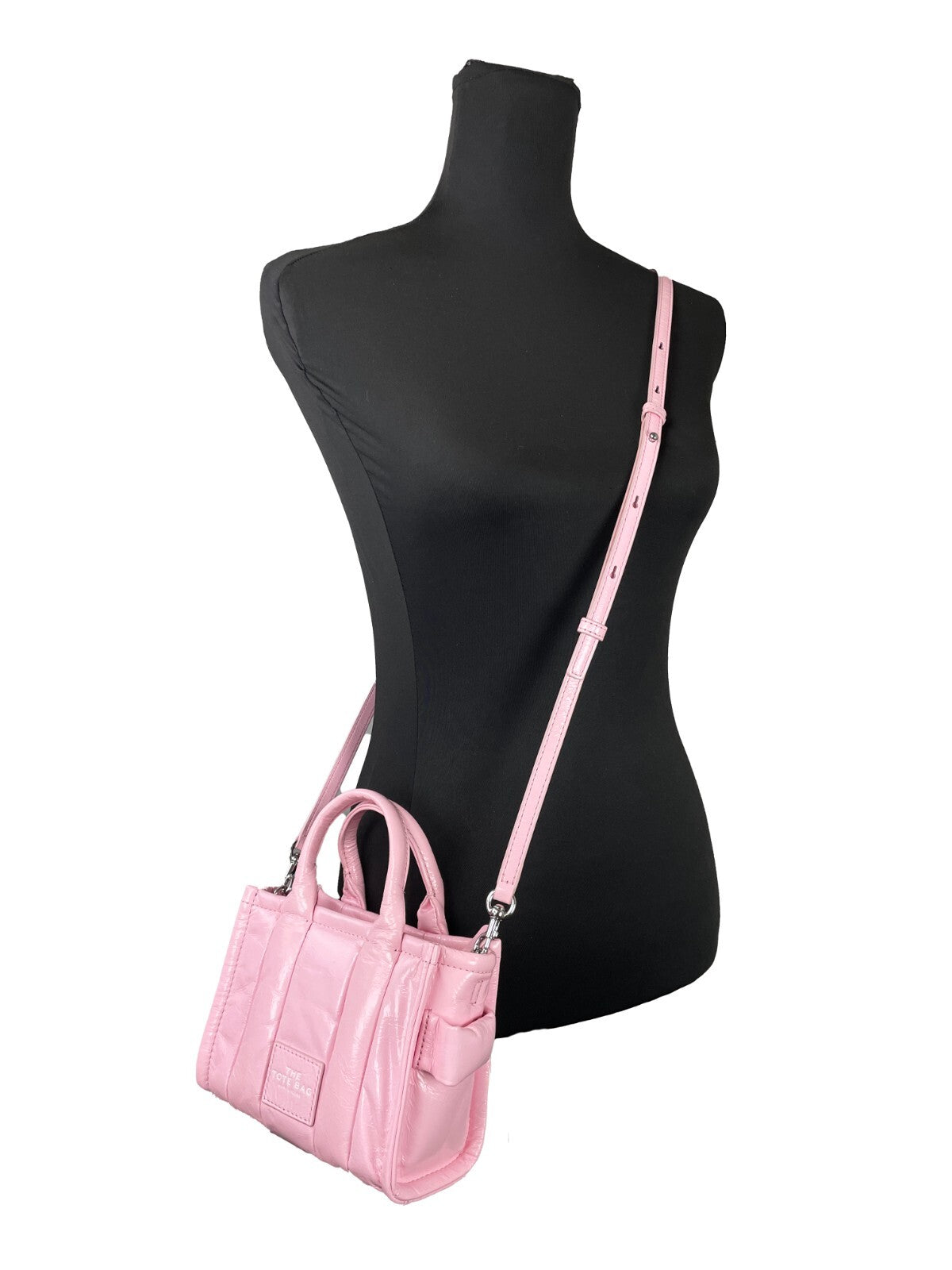 Micro Crossbody Evening Tote Handbag by Marc Jacobs for women in ostrich leather pink & silver features a versatile chic silhouette, meticulously detailed with a secure zipper, ample , and versatile crossbody-strap, adjustable-strap, detachable-strap & handle.
