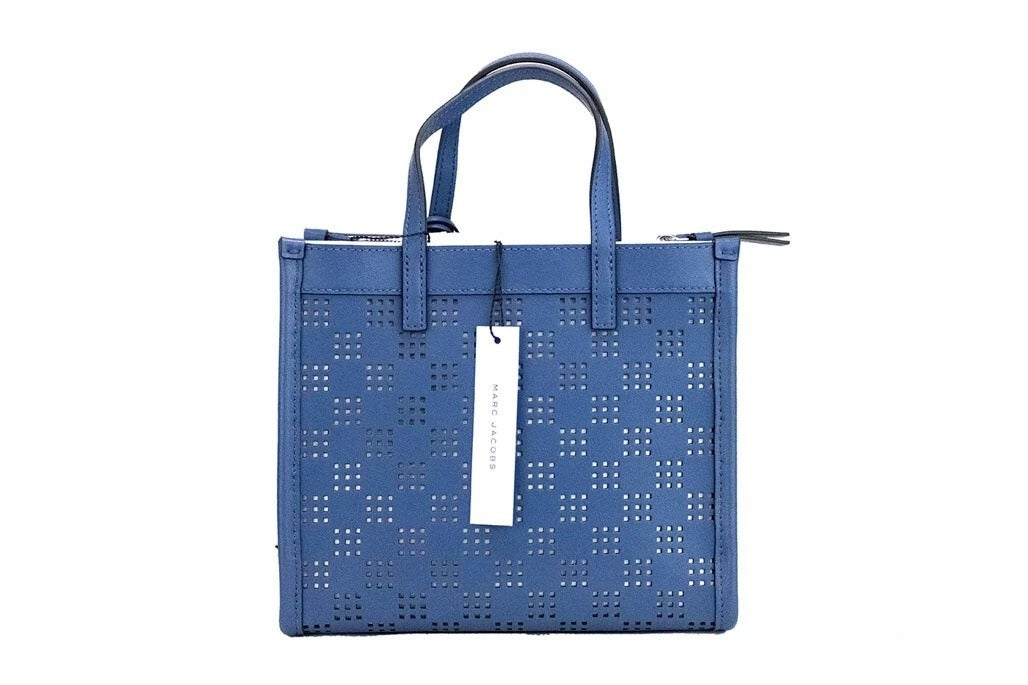 Mini Crossbody Tote Handbag by Marc Jacobs for women in pebbled leather blue, green & silver features an versatile silhouette, showcasing a secure zipper and versatile with versatile crossbody-strap, adjustable-strap, detachable-strap & handle for a versatile finish.