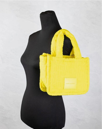 Small 2-in-1 Shoulder & Crossbody Tote Bag by Marc Jacobs for women in synthetic fabric silver, patterned & monogram features an effortlessly chic silhouette with a secure zipper, ample , and versatile crossbody-strap, shoulder-strap & handle for effortlessly chic everyday luxury.