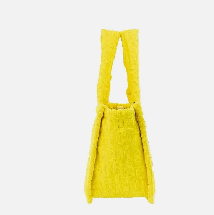 Small 2-in-1 Shoulder & Crossbody Tote Bag by Marc Jacobs for women in synthetic fabric silver, patterned & monogram features a effortless chic silhouette with a secure zipper, ample , and versatile crossbody-strap, shoulder-strap & handle for a effortless chic finish.