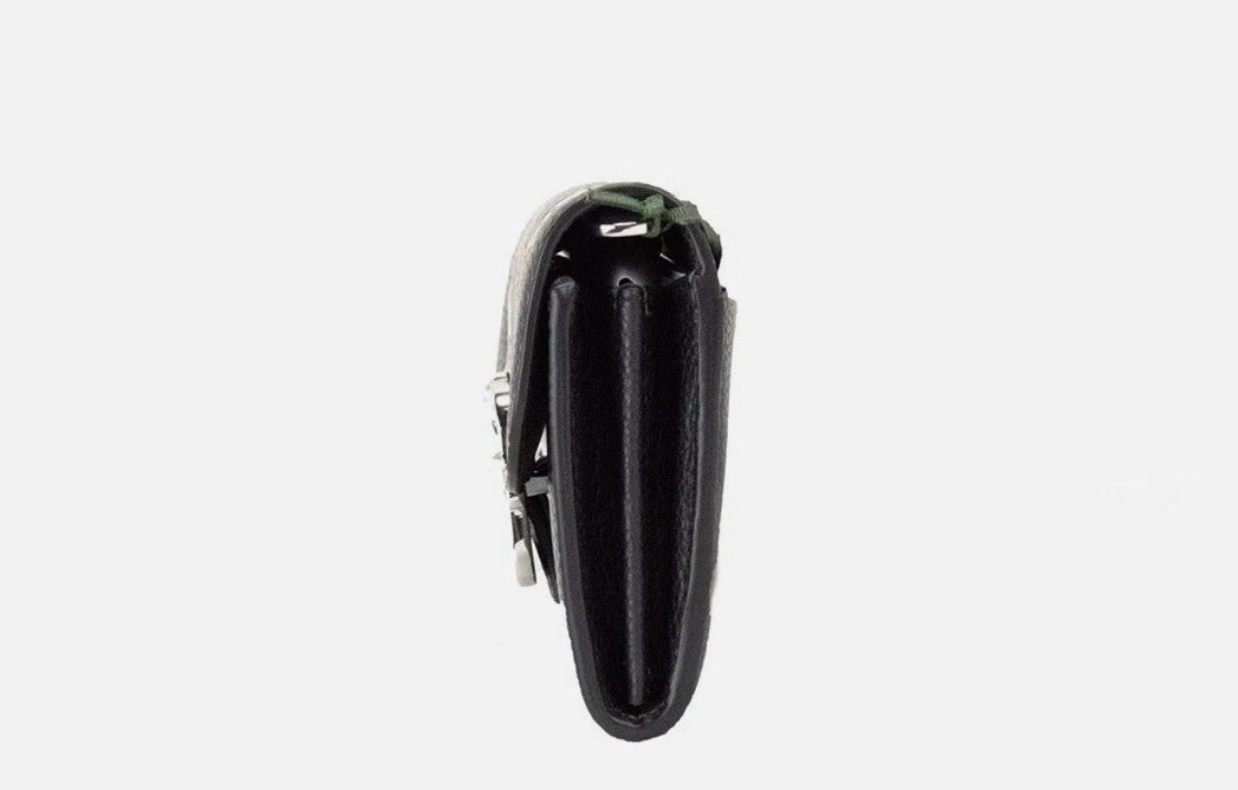 Small Crossbody Clutch Handbag by Kate Spade for women in faux patent leather black & silver presents a ornamental silhouette, showcasing a secure snap & zipper, ample cardholder, and versatile crossbody-strap & detachable-strap for a ornamental finish.