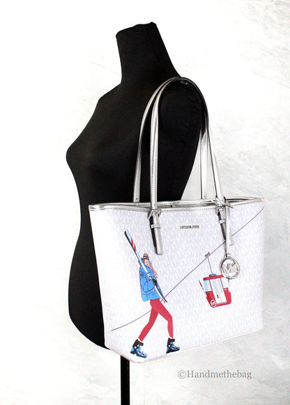 Medium Travel Tote Bag by Michael Kors for women in synthetic polyurethane leather silver, white, patterned & signature features an jet-set-ready silhouette, showcasing the Jet Set Travel Synthetic Polyurethane Leather Medium Tote Bag design with a secure hook, ample , and versatile handle.