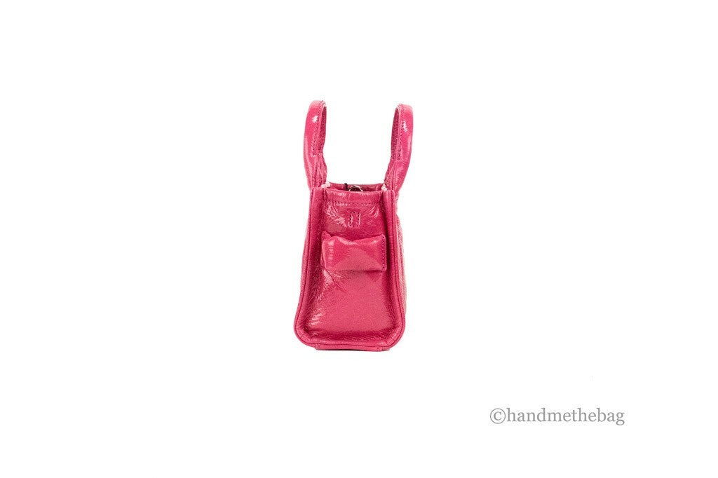 Micro 2-in-1 Shoulder & Crossbody Tote Handbag by Marc Jacobs for women in canvas & leather magenta, silver & patterned features a multifaceted silhouette, showcasing a secure zipper and multifaceted with versatile crossbody-strap, shoulder-strap, adjustable-strap & detachable-strap for multifaceted style.