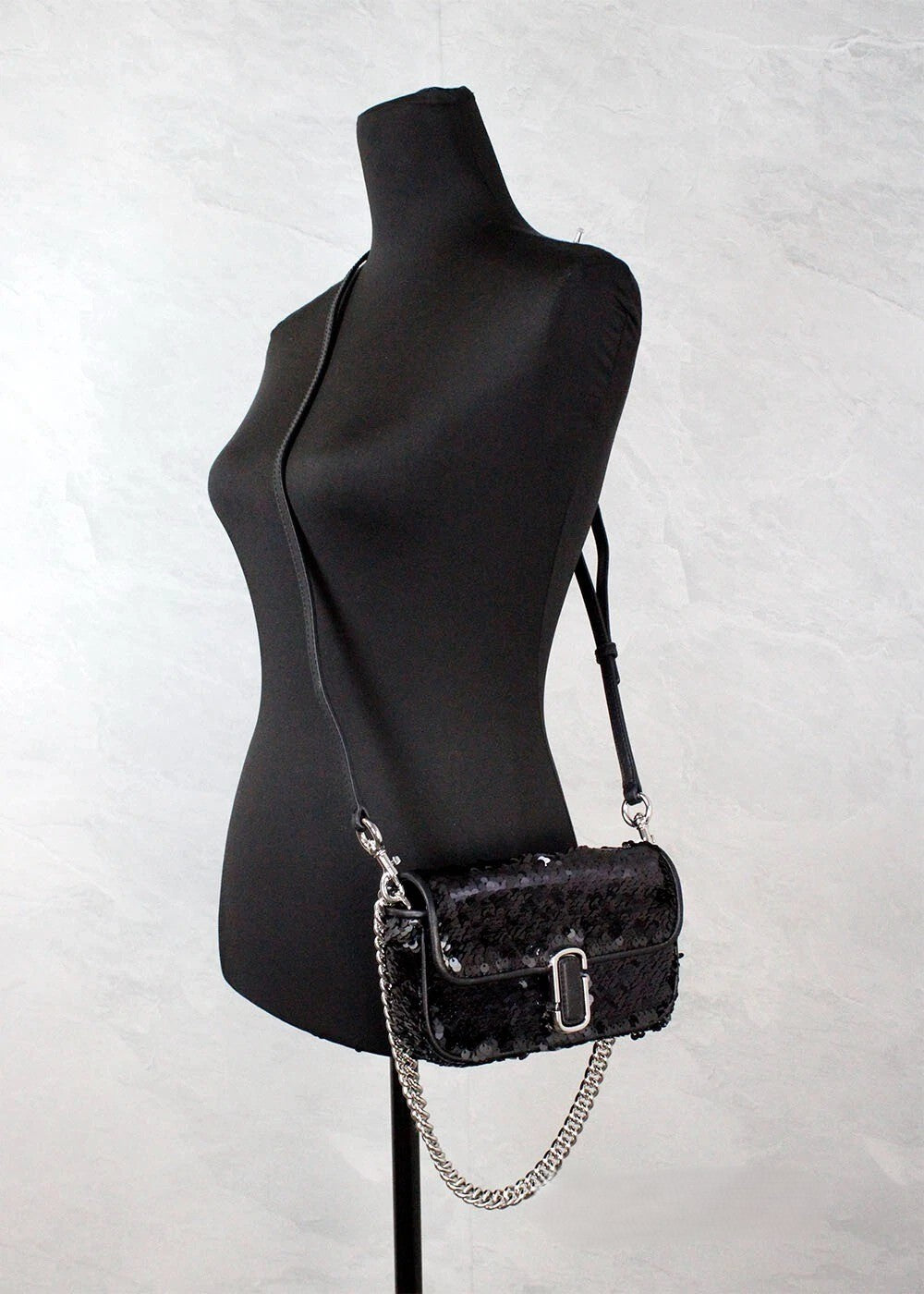 Mini 2-in-1 Shoulder & Crossbody Handbag by Marc Jacobs for women in leather black, silver & signature features a multifaceted silhouette, showcasing a secure zipper & magnetic and multifaceted cardholder with versatile crossbody-strap, shoulder-strap & adjustable-strap for multifaceted style.