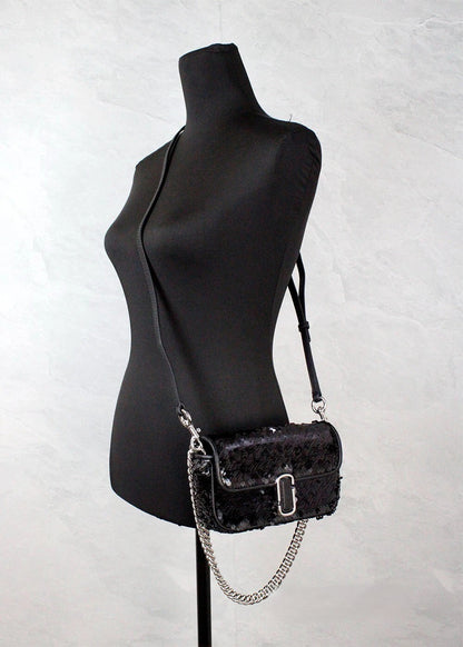 Mini 2-in-1 Shoulder & Crossbody Handbag by Marc Jacobs for women in leather black, silver & signature features a multifaceted silhouette, showcasing a secure zipper & magnetic and multifaceted cardholder with versatile crossbody-strap, shoulder-strap & adjustable-strap for multifaceted style.