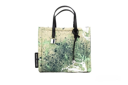 Mini Crossbody Travel Tote Handbag by Marc Jacobs for women in raffia & leather green, multicolor, silver & print features a versatile chic silhouette, meticulously detailed with a secure zipper, ample , and versatile crossbody-strap, adjustable-strap, detachable-strap & handle.