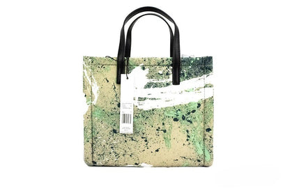 Mini Crossbody Travel Tote Handbag by Marc Jacobs for women in raffia & leather green, multicolor, silver & print features a transformative sophistication silhouette, showcasing a secure zipper, ample , and versatile crossbody-strap, adjustable-strap, detachable-strap & handle for a transformative sophistication look.