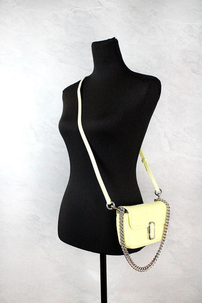 Mini 2-in-1 Shoulder & Crossbody Travel Handbag by Marc Jacobs for women in embossed leather animal, silver, yellow, patterned & print showcases a versatile sophistication silhouette, featuring a secure zipper & magnetic, versatile sophistication cardholder, and versatile crossbody-strap, shoulder-strap, adjustable-strap & detachable-strap for a versatile sophistication finish.
