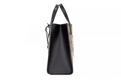Mini Crossbody Travel Tote Handbag by Marc Jacobs for women in faux patent leather black, gold, orange & print features a signature silhouette, showcasing a secure zipper and signature with versatile crossbody-strap, adjustable-strap, detachable-strap & handle for a sophisticated look.