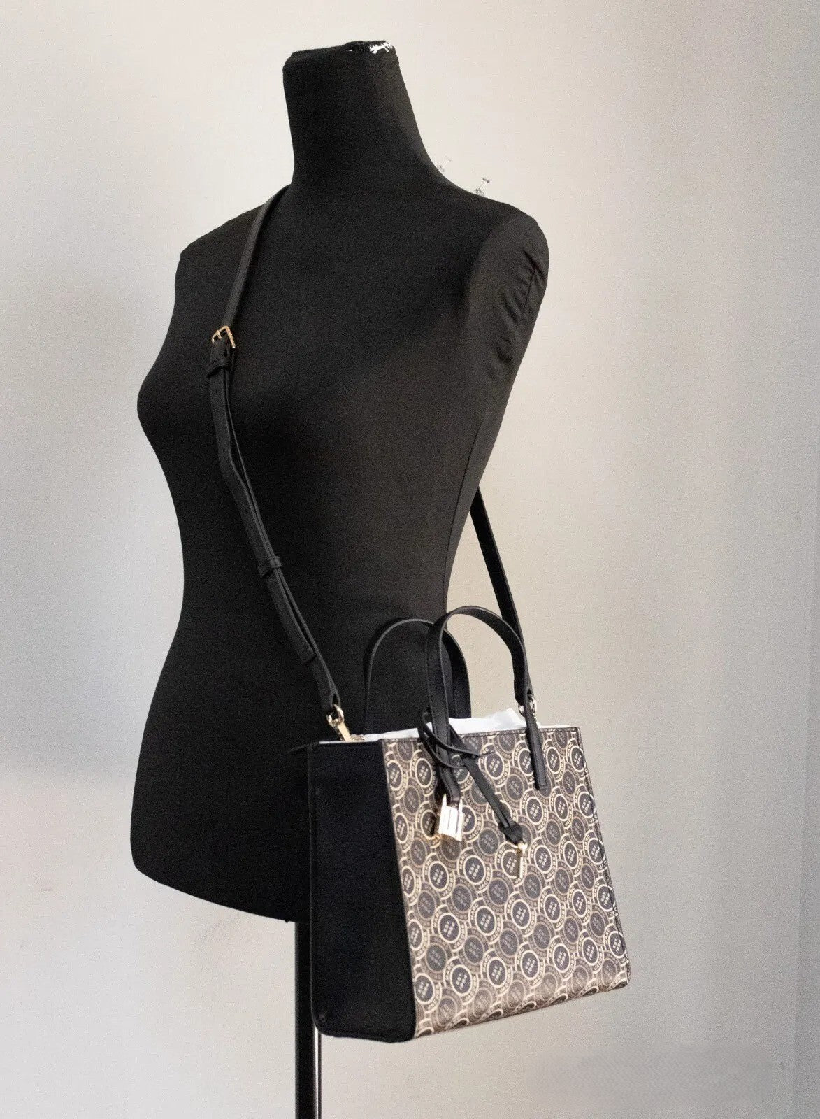 Mini Crossbody Travel Tote Handbag by Marc Jacobs for women in faux patent leather black, gold, orange & print features a exquisite silhouette, showcasing a secure zipper and exquisite with versatile crossbody-strap, adjustable-strap, detachable-strap & handle for a exquisite finish.
