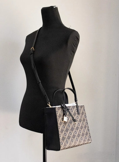 Mini Crossbody Travel Tote Handbag by Marc Jacobs for women in faux patent leather black, gold, orange & print features a exquisite silhouette, showcasing a secure zipper and exquisite with versatile crossbody-strap, adjustable-strap, detachable-strap & handle for a exquisite finish.