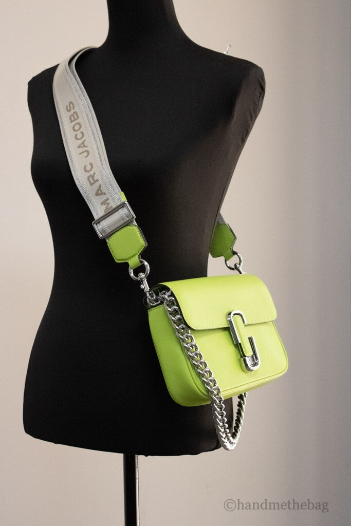Small 2-in-1 Shoulder & Crossbody Travel Bag by Marc Jacobs for women in cotton polyester canvas green & silver features an effortlessly chic silhouette with a secure magnetic, ample , and versatile crossbody-strap, shoulder-strap, adjustable-strap & detachable-strap for effortlessly chic everyday luxury.