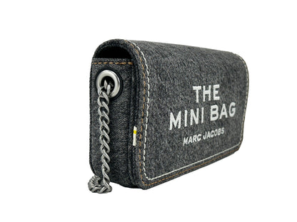 Mini Crossbody Handbag by Marc Jacobs for women in stretch denim & viscose black & silver features an refined silhouette, showcasing a secure magnetic, ample , and versatile crossbody-strap for a sophisticated refined aesthetic.