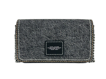 This Mini Crossbody Handbag by Marc Jacobs for women in stretch denim & viscose and black & silver presents a sculptural silhouette featuring a secure magnetic, ample , and versatile crossbody-strap for a sculptural finish.