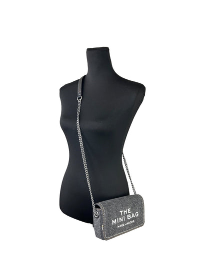 Mini Crossbody Handbag by Marc Jacobs for women in stretch denim & viscose black & silver features an refined silhouette, showcasing a secure magnetic, ample , and versatile crossbody-strap for a sophisticated refined aesthetic.