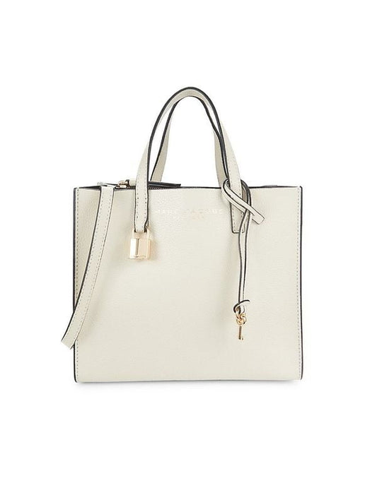 Mini Tote Bag by Marc Jacobs for women in canvas & leather black, gold, marshmallow & white showcases a statuesque Canvas & Leather Mini Tote Bag design, featuring a secure , ample , and versatile adjustable-strap, detachable-strap & handle for a statuesque finish.