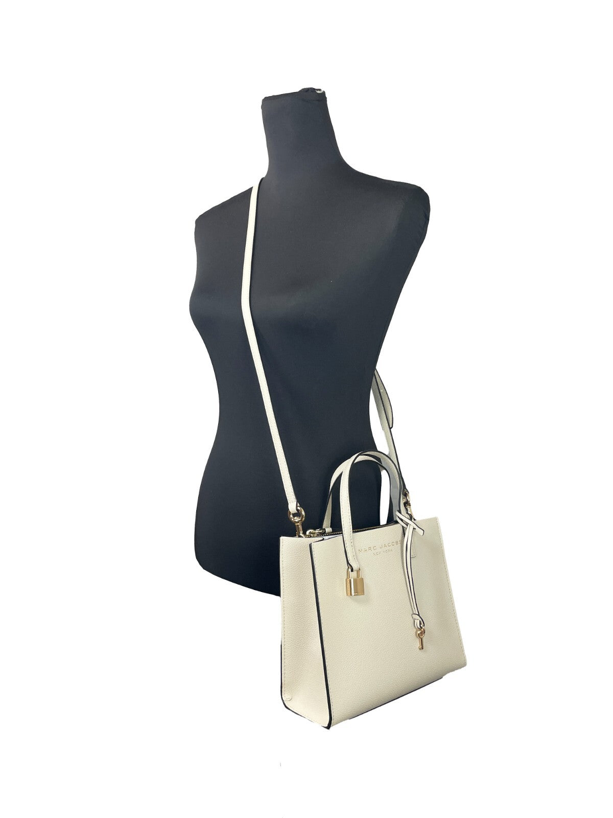 Mini Tote Bag by Marc Jacobs for women in canvas & leather black, gold, marshmallow & white features an jet-set-ready silhouette, showcasing the Canvas & Leather Mini Tote Bag design with a secure , ample , and versatile adjustable-strap, detachable-strap & handle.