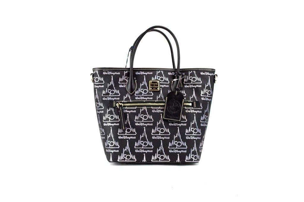 Medium Crossbody Travel Tote Bag by Dooney & Bourke for women in leather black, gold & patterned features an jet-setting Walt Disney World 50Th Anniversary Leather Medium Crossbody Travel Tote Bag design with a secure zipper, jet-setting , and versatile crossbody-strap, adjustable-strap, detachable-strap & handle for a jet-setting look.