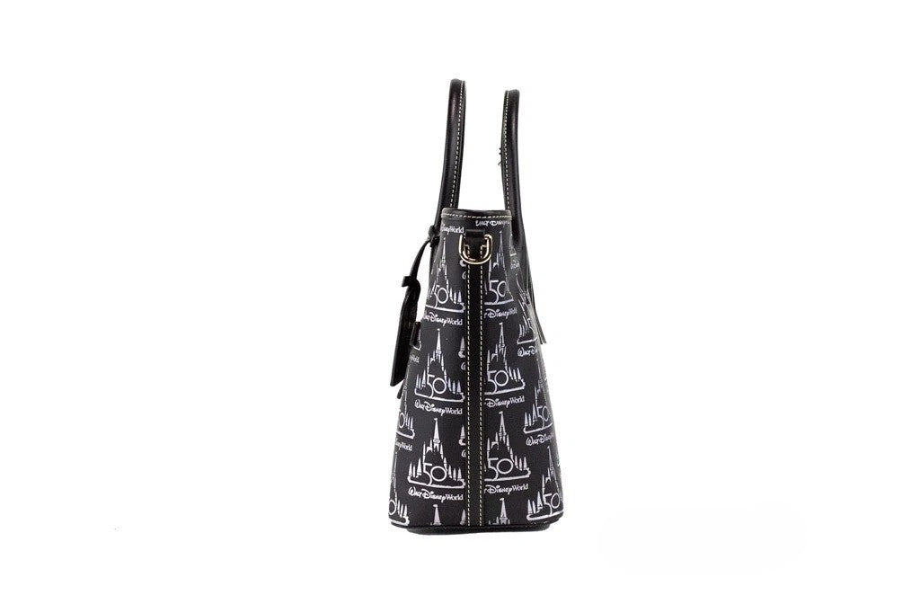 Medium Crossbody Travel Tote Bag by Dooney & Bourke for women in leather black, gold & patterned features an jet-set-ready silhouette, showcasing the Walt Disney World 50Th Anniversary Leather Medium Crossbody Travel Tote Bag design with a secure zipper, ample , and versatile crossbody-strap, adjustable-strap, detachable-strap & handle.