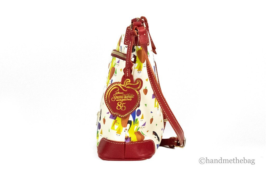 Medium Crossbody Handbag by Dooney & Bourke for women in leather cotton polyethylene gold, orange, red, white & patterned features an multi-faceted design with a secure , ample , and versatile crossbody-strap & adjustable-strap for a multi-faceted finish.
