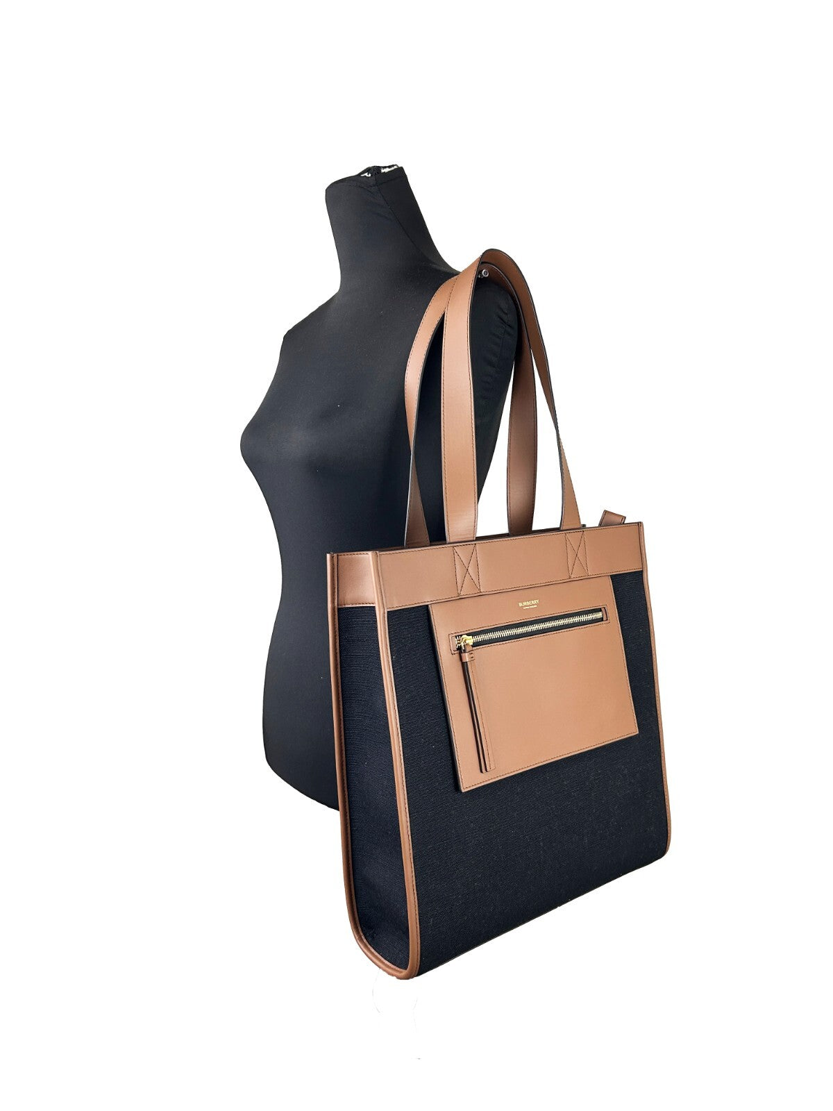 Small Travel Tote Bag by Burberry for women in canvas gold & multicolor features a jet-set sophisticated Canvas Small Travel Tote Bag design with a secure zipper, ample , and versatile handle for a jet-set sophisticated finish.