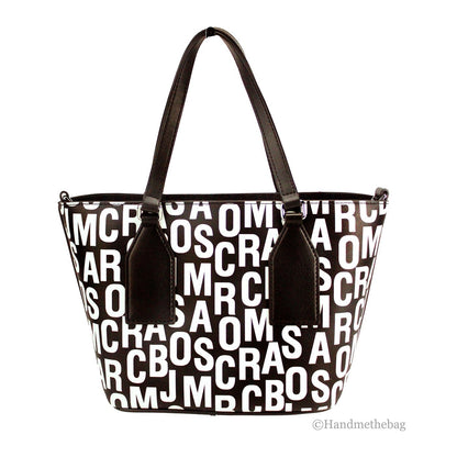 Small Crossbody Travel Tote Handbag by Marc Jacobs for women in leather & rubber black, silver, white, patterned, monogram & print features a transformative elegance silhouette, showcasing a secure zipper, organized , and versatile crossbody-strap, adjustable-strap, detachable-strap & handle for a transformative elegance look.